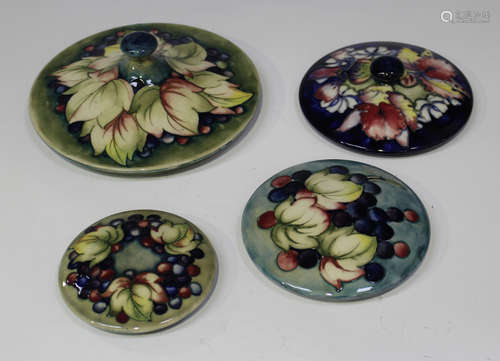 Four Moorcroft pottery circular lids