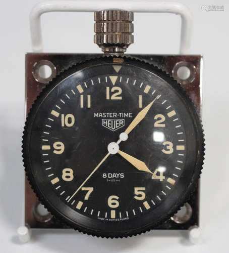 A Heuer Master-Time base metal cased keyless wind dashboard clock