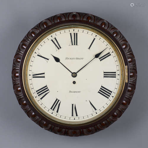 A late Victorian mahogany circular wall timepiece with single fusee movement