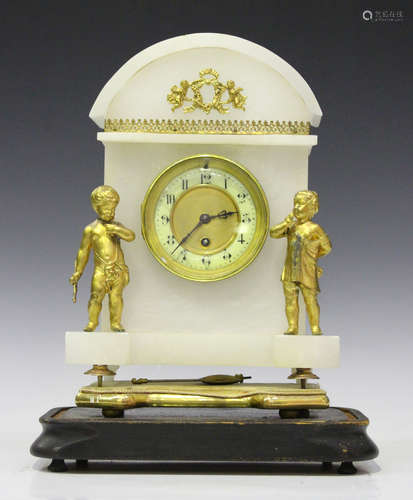 A late 19th century French gilt spelter and alabaster mantel timepiece with eight day movement