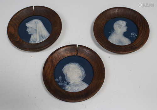 Three French pâte-sur-pâte porcelain circular plaques