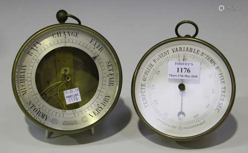 An early 20th century French brass cased circular holosteric wall barometer by Naudet & Cie