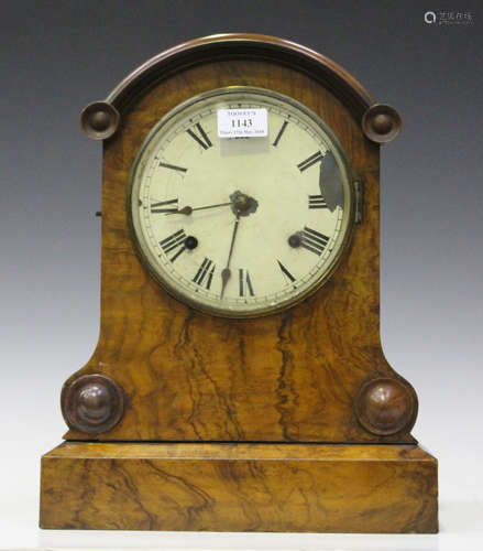 A Victorian burr walnut mantel clock with eight day movement striking on a bell and gong