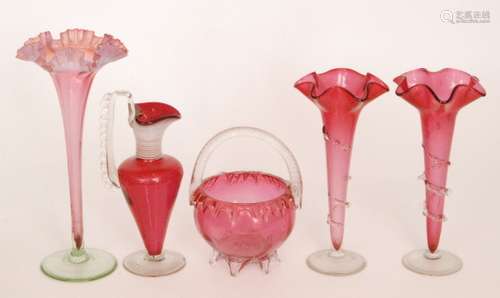 A group of late 19th Century Cranberry glass comprising a pair of trumpet vases each with wave edge rim and applied trailing