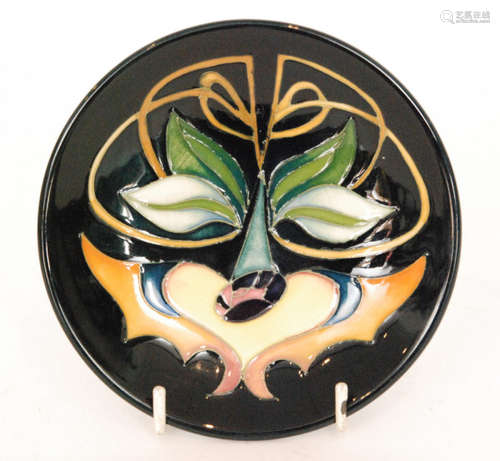 A Moorcroft Pottery pin dish coaster decorated in the Miller Howe pattern