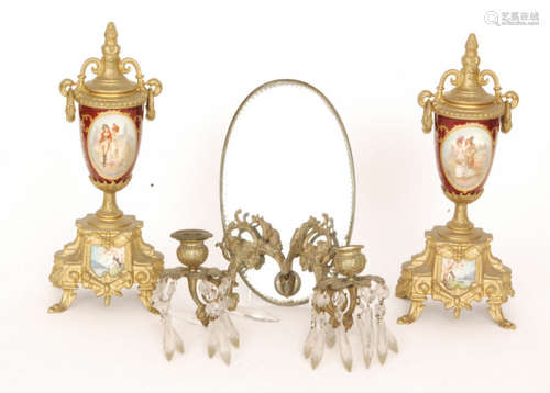 A 19th Century French urn shaped porcelain clock garnitures painted with oval panels of courting couples