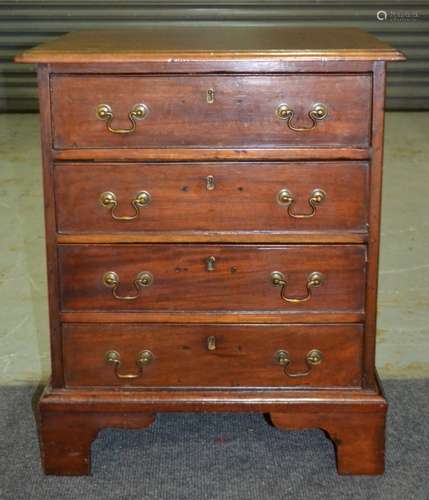 A small mahogany chest of four cockbeaded drawers in the Georgian style