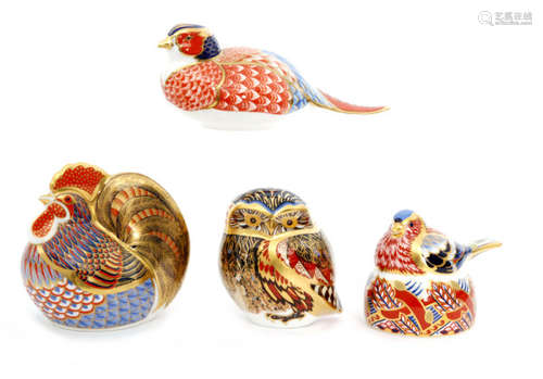 Four assorted Royal Crown Derby paperweights comprising an owl