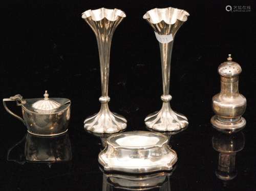 A pair of hallmarked silver trumpet bud vases