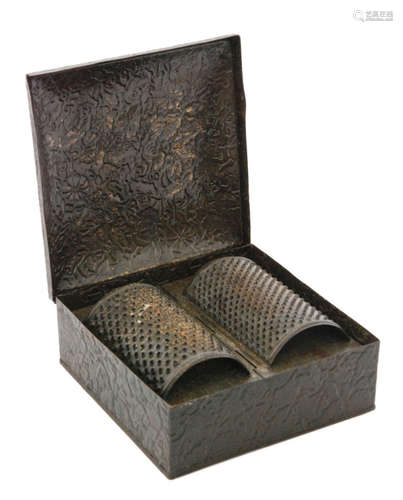 A Victorian square metal tin embossed with flowers and vines opening to reveal two semi circular grates stamped Nutmeg and Bread above a four compartment base