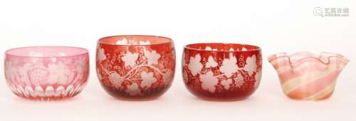 A composed pair of late 19th Century Bohemian glass finger bowls flashed in ruby over clear and engraved with fruiting vine decoration