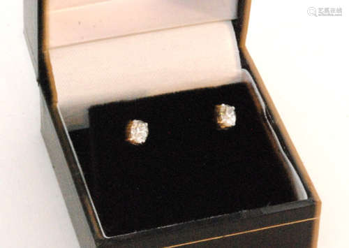 A pair of 18ct white gold oval cut diamond stud earrings