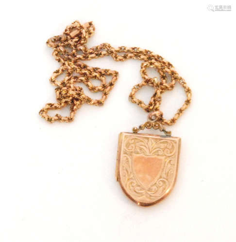 A 9ct hallmarked rose gold shield shaped locket with foliate engraved decoration