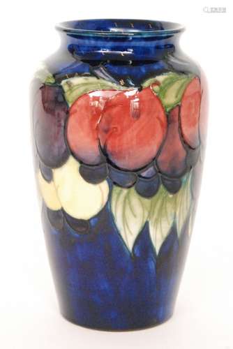 A William Moorcroft Wisteria pattern vase of shouldered form decorated with a band of plums