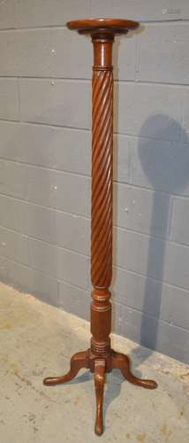 A 19th Century mahogany spiral pedestal torchere on four splayed legs