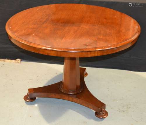 A Victorian mahogany circular occasional table on fluted octagonal pedestal over a tricorn base