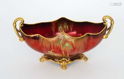 A 1930s Carlton Ware New Stork pattern table bowl decorated with a gilt and enamel scene of storks beneath a trailing tree