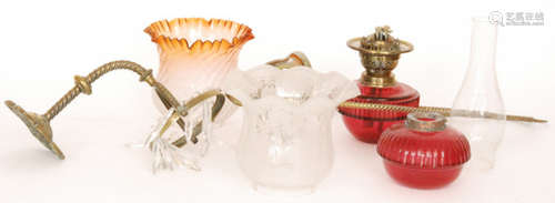 A Victorian drop lustre oil lamp and shade with ruby reservoir and a similar suspended ceiling oil lamp with crimped shade