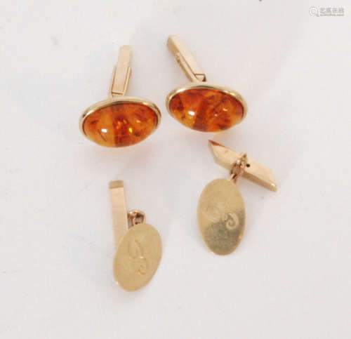 A modern pair of 9ct hallmarked amber set swivel cufflinks