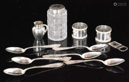 A small parcel lot of assorted silver and white metal items to include a miniature cream jug