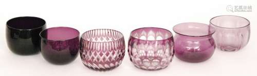 A group of seven 19th Century and later amethyst glass finger bowls comprising three plain examples