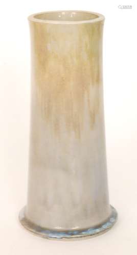 A large Ruskin Pottery footed cylinder vase decorated with a streaked yellow to blue with pale blue glaze pooling to the foot