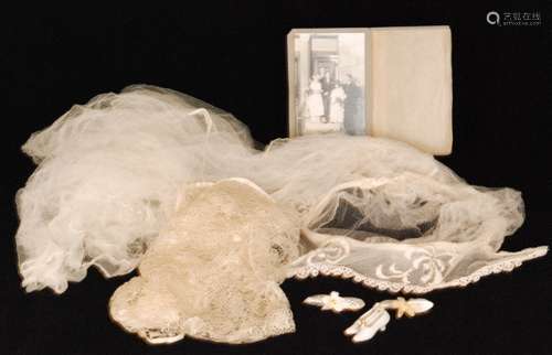 A 1920s vintage wedding veil in the Tudor style with a cream head piece and long chiffon train