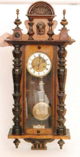 A late 19th Century walnut cased regulator wall clock with spring driven movement enclosed by a glazed door