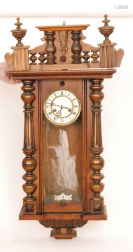 A late 19th Century walnut cased regulator wall clock with spring driven movement enclosed by a glazed door