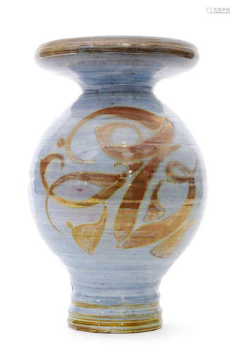 A post war studio pottery Aldermaston vase decorated by Oldrich Asenbryl with lustre painted brush strokes over the blue wash ground