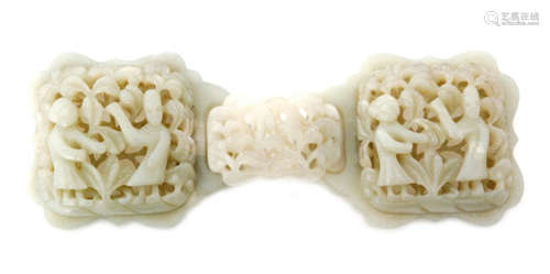 A Chinese celadon jade three part belt buckle