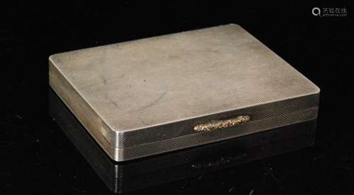 A hallmarked silver rectangular engine turned box with gilded raised thumb piece