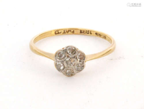 An early 20th Century 18ct diamond daisy cluster ring