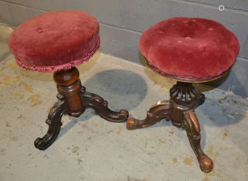 Two Victorian revolving piano stools each upholstered in crimson and pink plush