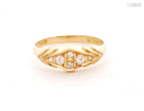 An early 20th Century 18ct hallmarked seven stone diamond boat shaped ring