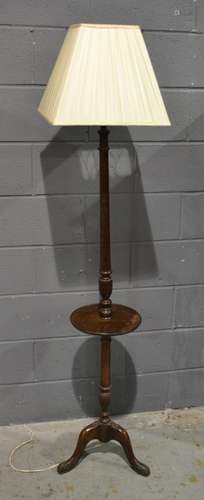 An Edwardian mahogany tripod standard lamp complete with shade