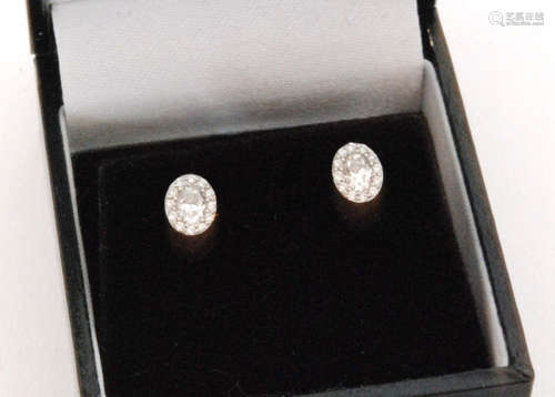 A pair of 18ct white gold diamond cluster earrings