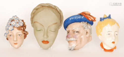 Four assorted 1930s Art Deco face masks comprising two Goebel examples