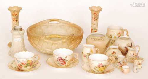 A small collection of assorted Royal Worcester blush ivory to include two teacups and saucers and a small ovoid vase decorated with a hand painted bird perched on gilt branches