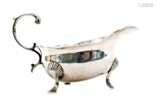 A George II hallmarked silver sauce boat