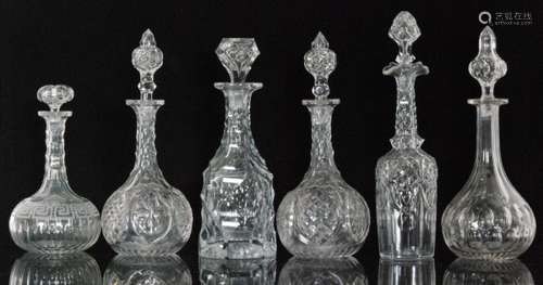 A group of 19th Century and later clear glass decanters comprising a heavily facet cut example