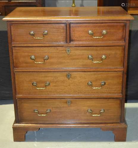 A reproduction mahogany chest of two short over three long drawers in the Georgian style