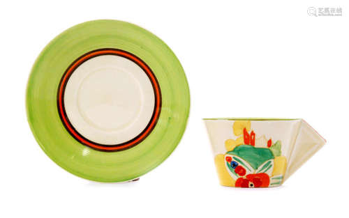 A Clarice Cliff conical shape cup and saucer circa 1934 hand painted in the Alton (Green) with a stylised castle to a distant landscape setting with orange