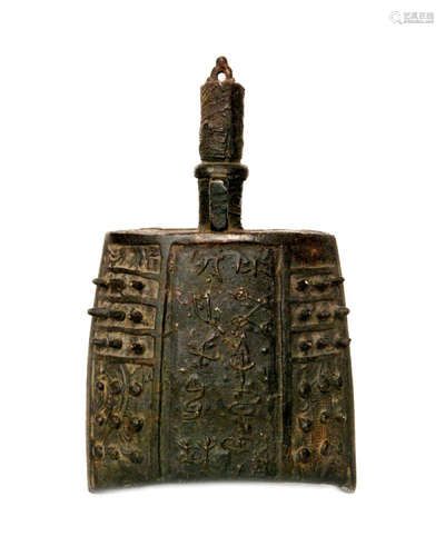 A Chinese archaic style bronze hand bell or Zhong of elliptical outline with arched sides