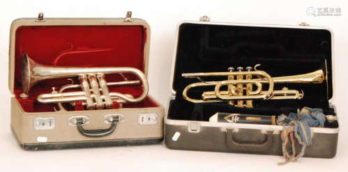 An American brass trumpet 'Bundy' with mouth piece and a similar Chinese trumpet