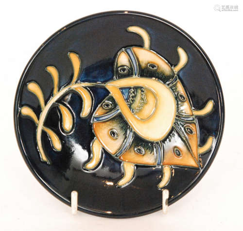 A Moorcroft Pottery Collectors Club pin dish coaster decorated in the Vintage Plume pattern designed by Hayley Cook