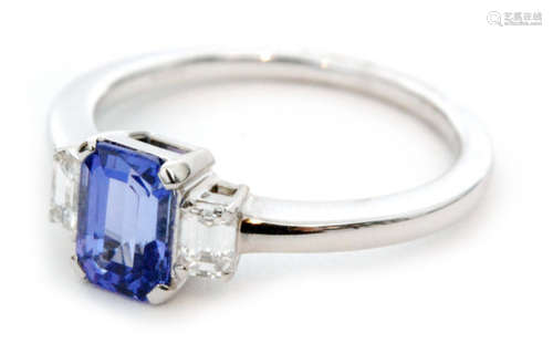 An 18ct white gold tanzanite and diamond three stone ring