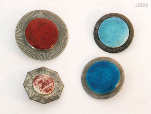 A selection of four Ruskin style brooches of various designs