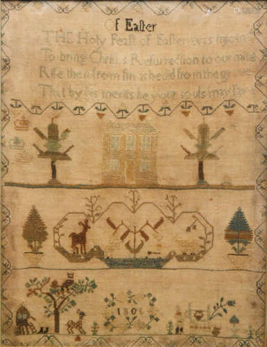 An early 19th Century needlework sampler with embroidered religious verse to the top with a Georgian house beneath framed with trees