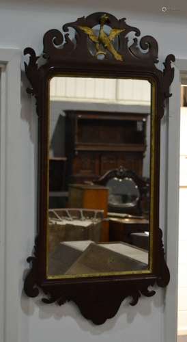 A Georgian style wall mirror with a mahogany pierced fretwork frieze